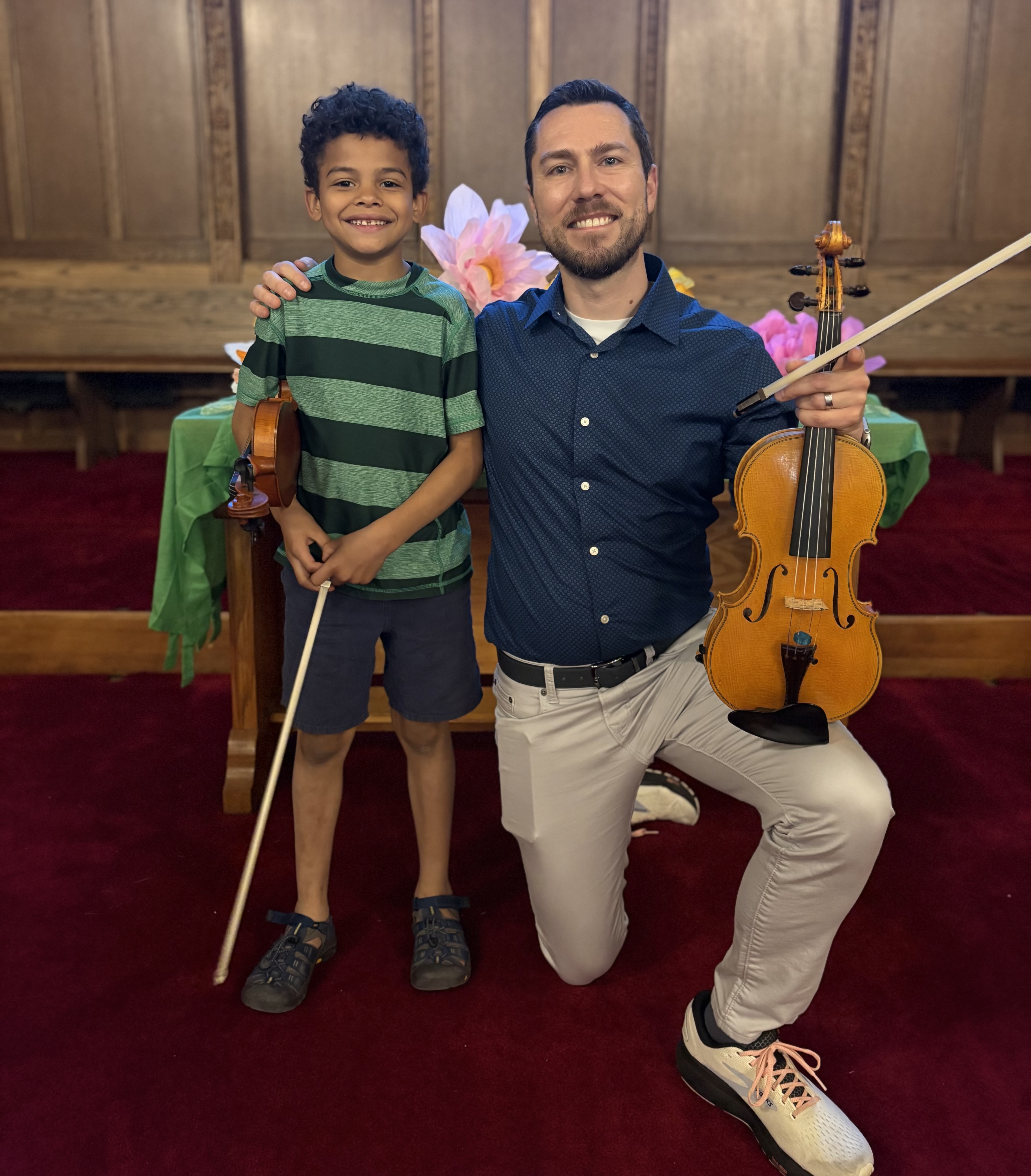 William Samorey with a young violin student in a church recital setting